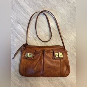 Sabina New York women's brown leather crossbody wristlet.
